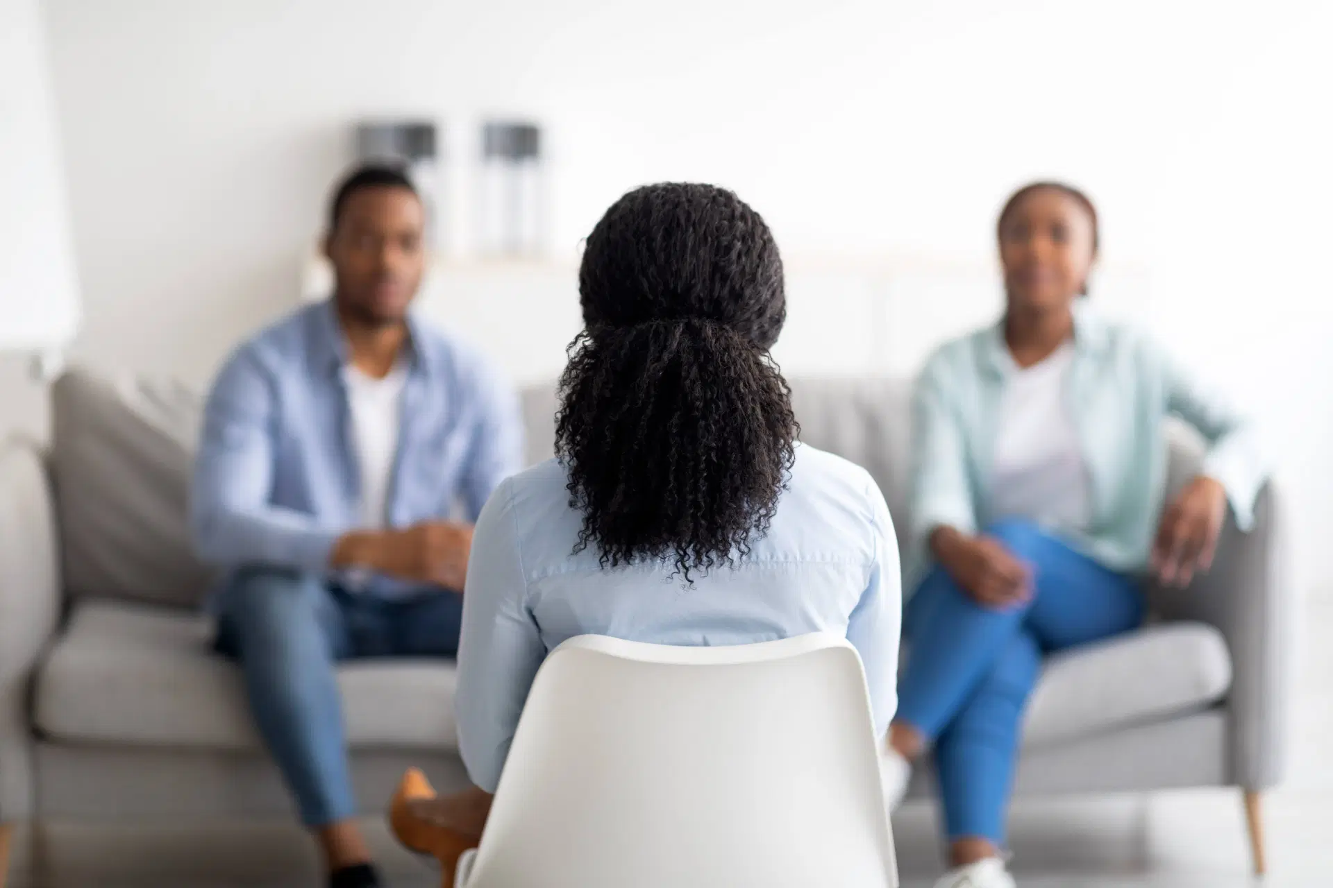 Couple discussing issues with therapist in office